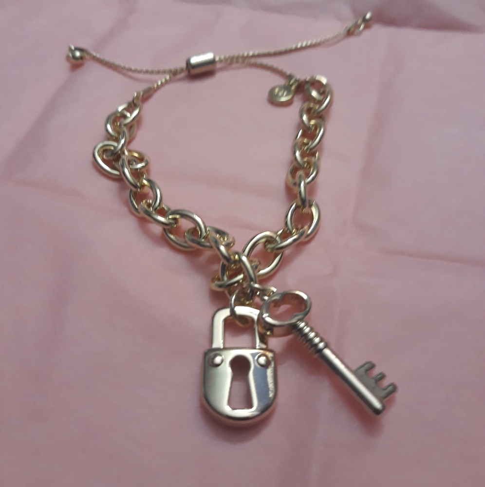 Mary Kay " you hold the key" gold bracelet.NWT